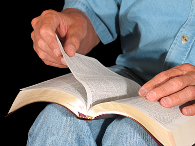 bible_on_knee_bigger.jpg